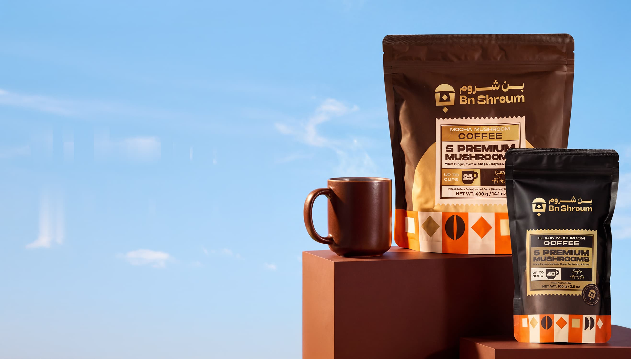 Bn Shroum mushroom mocha and black coffee pouches beside a mug of coffee